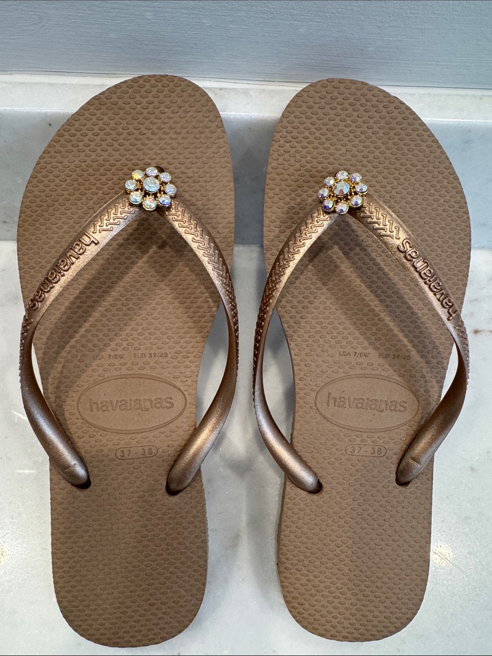 Havaianas Women’s Bronze Flip Flops with Jeweled Flower